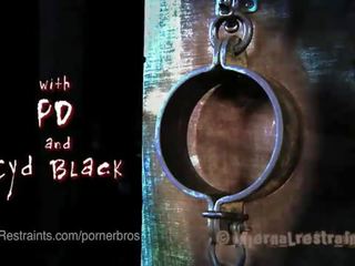 Blonde in metal & leather bondage predicaments